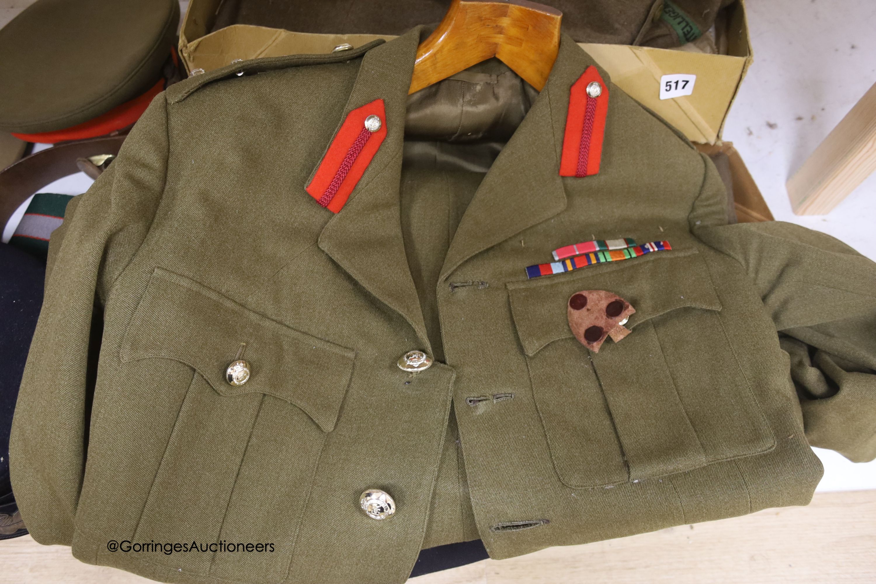 An R.A. cap, dress jacket, pith helmet and SRN uniform